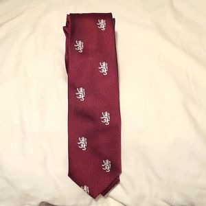 Vintage Paul Greco necktie burgundy with English Lion pattern made in Britain.